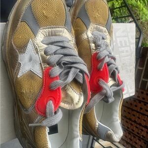 Golden Goose Laminated Sneakers in Gold and White